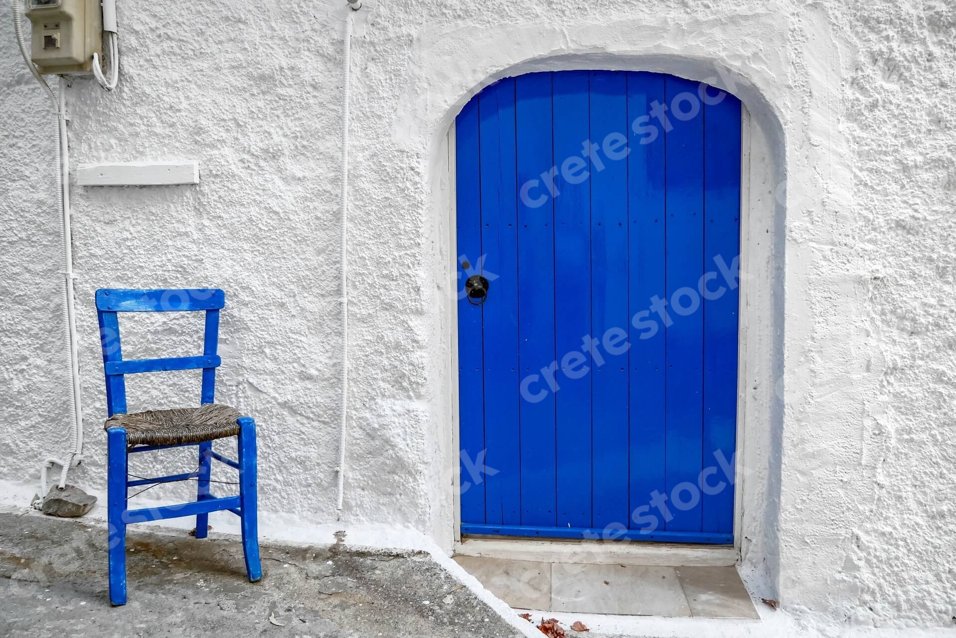 blue-door-chair-in-kritsa-village-in-agios-nikolaos-lasithi