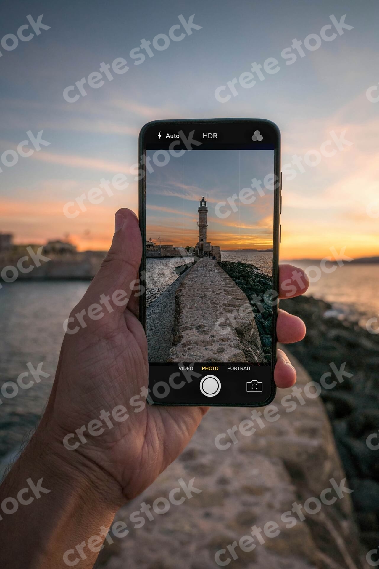 venetian-lighthouse-in-chania-old-port-at-sunset